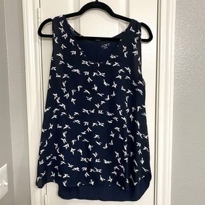 Sleeveless top with white outline bird accents